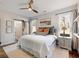 Spacious primary bedroom with a king-size bed and large windows at 4258 Hog Mountain Rd, Hoschton, GA 30548