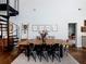Farmhouse-style dining room with rustic wood table and metal chairs at 4258 Hog Mountain Rd, Hoschton, GA 30548