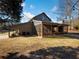 Exterior view of house with screened porch and wooded backdrop at 4258 Hog Mountain Rd, Hoschton, GA 30548