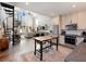 Open concept kitchen with stainless steel appliances and custom cabinetry at 4258 Hog Mountain Rd, Hoschton, GA 30548