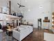 Open-plan living area with loft, fireplace and large windows at 4258 Hog Mountain Rd, Hoschton, GA 30548
