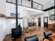Modern living room features a wood-burning stove and an open floor plan at 4258 Hog Mountain Rd, Hoschton, GA 30548