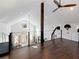 Spacious loft area with hardwood floors and a ceiling fan at 4258 Hog Mountain Rd, Hoschton, GA 30548
