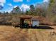 Open air storage area for a tractor and small trailer at 4258 Hog Mountain Rd, Hoschton, GA 30548