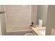 Clean bathroom with white subway tile and bathtub at 33 Country Place Ct, Alpharetta, GA 30005