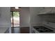 Kitchen with white cabinets and gas stove at 33 Country Place Ct, Alpharetta, GA 30005