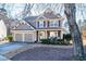 Two-story house with gray siding, two-car garage, and landscaped yard at 4905 Clearstone Nw Way, Acworth, GA 30101