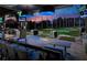 Modern bar with granite countertop, overlooks Topgolf driving range at sunset at 1921 Rogers Ct, Atlanta, GA 30318