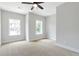 Bright bedroom with neutral walls and ceiling fan at 202 Grady Burrell Dr, Holly Springs, GA 30115