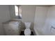 Clean bathroom with tub, toilet, and vanity at 227 Camp Creek Sw Rd, Lilburn, GA 30047