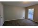 Bright bedroom with neutral walls and carpet flooring at 227 Camp Creek Sw Rd, Lilburn, GA 30047