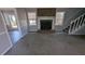 Living room with brick fireplace and carpet at 227 Camp Creek Sw Rd, Lilburn, GA 30047