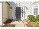 Gray front door with white columns and landscaping at 5720 Millstone Dr, Cumming, GA 30028