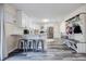 Open concept kitchen with island and white shaker cabinets at 5720 Millstone Dr, Cumming, GA 30028