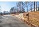 Residential street with a house visible in the background at 5720 Millstone Dr, Cumming, GA 30028