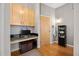 Entryway with built-in shelving and wood flooring at 943 Peachtree Ne St # 809, Atlanta, GA 30309
