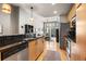 Open concept kitchen with stainless steel appliances and island seating at 943 Peachtree Ne St # 809, Atlanta, GA 30309