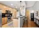 Modern kitchen with stainless steel appliances and light wood cabinets at 943 Peachtree Ne St # 809, Atlanta, GA 30309