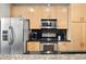 Modern kitchen with stainless steel appliances and granite countertops at 943 Peachtree Ne St # 809, Atlanta, GA 30309