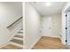 Unfinished basement with stairs and extra room at 152 Palm St, Holly Springs, GA 30115
