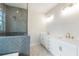 Elegant bathroom with double vanity, large shower, and marble floors at 152 Palm St, Holly Springs, GA 30115