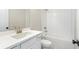 Clean bathroom with white subway tile and bathtub at 152 Palm St, Holly Springs, GA 30115