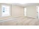 Spacious basement bedroom with large window and carpet at 152 Palm St, Holly Springs, GA 30115