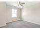 Spacious bedroom with ceiling fan and plush carpeting at 152 Palm St, Holly Springs, GA 30115