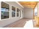 Covered deck with wood flooring and surrounding view at 152 Palm St, Holly Springs, GA 30115