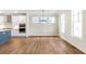 Dining room with hardwood floors and kitchen view at 152 Palm St, Holly Springs, GA 30115