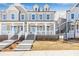 Two-story craftsman home with front porch and brick facade at 152 Palm St, Holly Springs, GA 30115