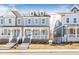 Two story home with front porch and brick accents at 152 Palm St, Holly Springs, GA 30115