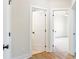 Bright hallway with doors to bedrooms and bathroom at 152 Palm St, Holly Springs, GA 30115