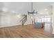 Open living room with hardwood floors and kitchen island view at 152 Palm St, Holly Springs, GA 30115