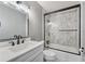 Clean bathroom with white vanity, subway tile shower and bathtub at 777 Forrest Nw St, Atlanta, GA 30318