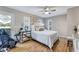 Spacious bedroom with hardwood floors and a door leading to a private deck at 777 Forrest Nw St, Atlanta, GA 30318