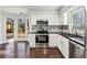 Well-equipped kitchen with stainless steel appliances and granite counters at 125 River Terrace Ct, Roswell, GA 30076