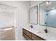 Modern bathroom with double vanity and light blue tile shower at 292 Creighton Ave, Scottdale, GA 30079