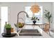 Modern kitchen sink and faucet with marble countertop at 292 Creighton Ave, Scottdale, GA 30079