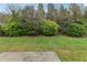 Landscaped backyard with grassy area at 6057 Hemperly Rd, Atlanta, GA 30349