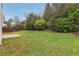 Landscaped backyard with grassy area at 6057 Hemperly Rd, Atlanta, GA 30349