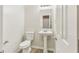 Clean and simple bathroom with pedestal sink at 6057 Hemperly Rd, Atlanta, GA 30349