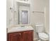 Clean bathroom with wood vanity and bathtub at 6057 Hemperly Rd, Atlanta, GA 30349