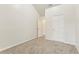 Spacious bedroom with neutral carpeting and ample closet space at 6057 Hemperly Rd, Atlanta, GA 30349