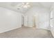 Spacious bedroom with vaulted ceiling, ceiling fan, and ensuite bath access at 6057 Hemperly Rd, Atlanta, GA 30349