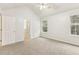 Primary bedroom with vaulted ceiling, ceiling fan, and ensuite bath at 6057 Hemperly Rd, Atlanta, GA 30349
