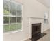 Simple white fireplace in living room at 6057 Hemperly Rd, Atlanta, GA 30349