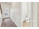 Bright foyer with tile floors, half bathroom, and wainscoting at 6057 Hemperly Rd, Atlanta, GA 30349
