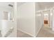 Upstairs hallway with carpet and access to bedrooms at 6057 Hemperly Rd, Atlanta, GA 30349