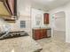Kitchen boasts granite countertops and stainless steel appliances at 6057 Hemperly Rd, Atlanta, GA 30349